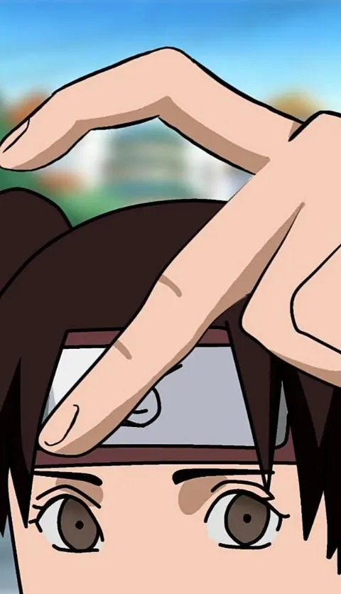 Tenten com mao fazendo coracao